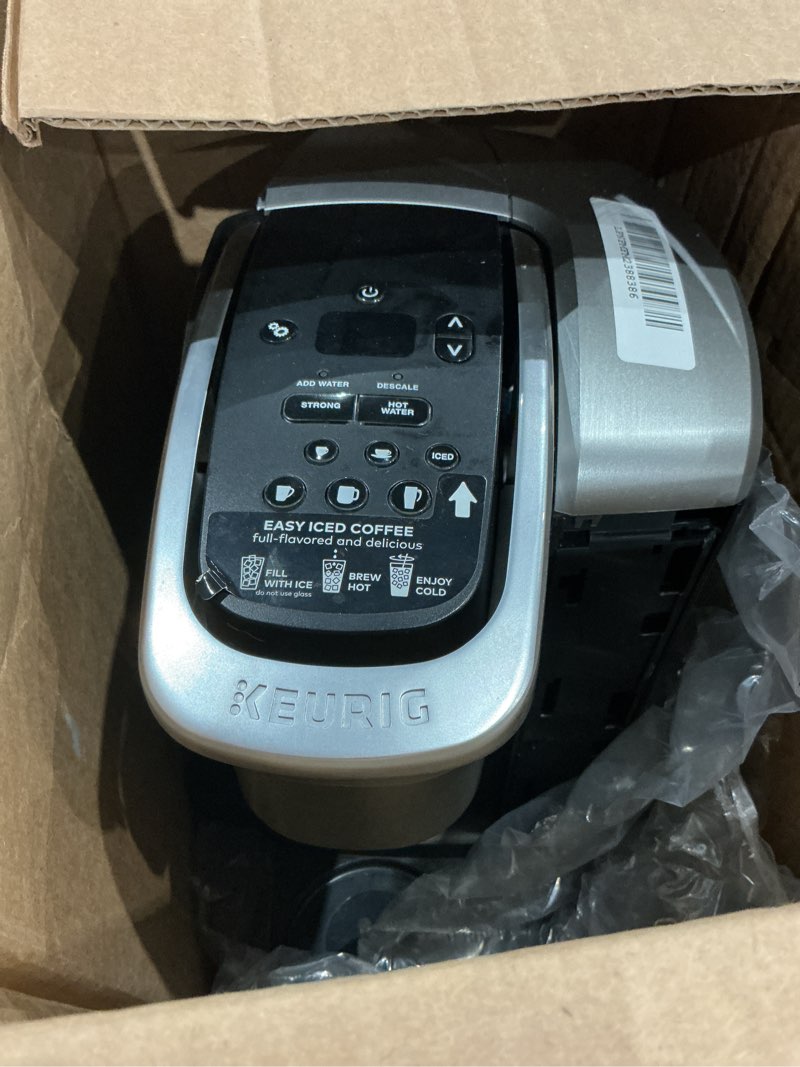 Condition photo showing As Is for (imcomplete, missing pieces)keurig k-elite single serve k-cup pod coffee maker, with strength and temperature control, iced coffee capability, 8 to 12oz brew size, programmable, brushed silver
