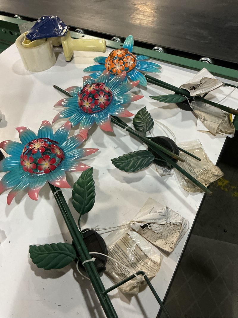 Condition photo showing As Is for metal flower garden stakes , large colorful decorative landscape and gardening outdoor decor, lawn and yard ornament, rust and weather resistant