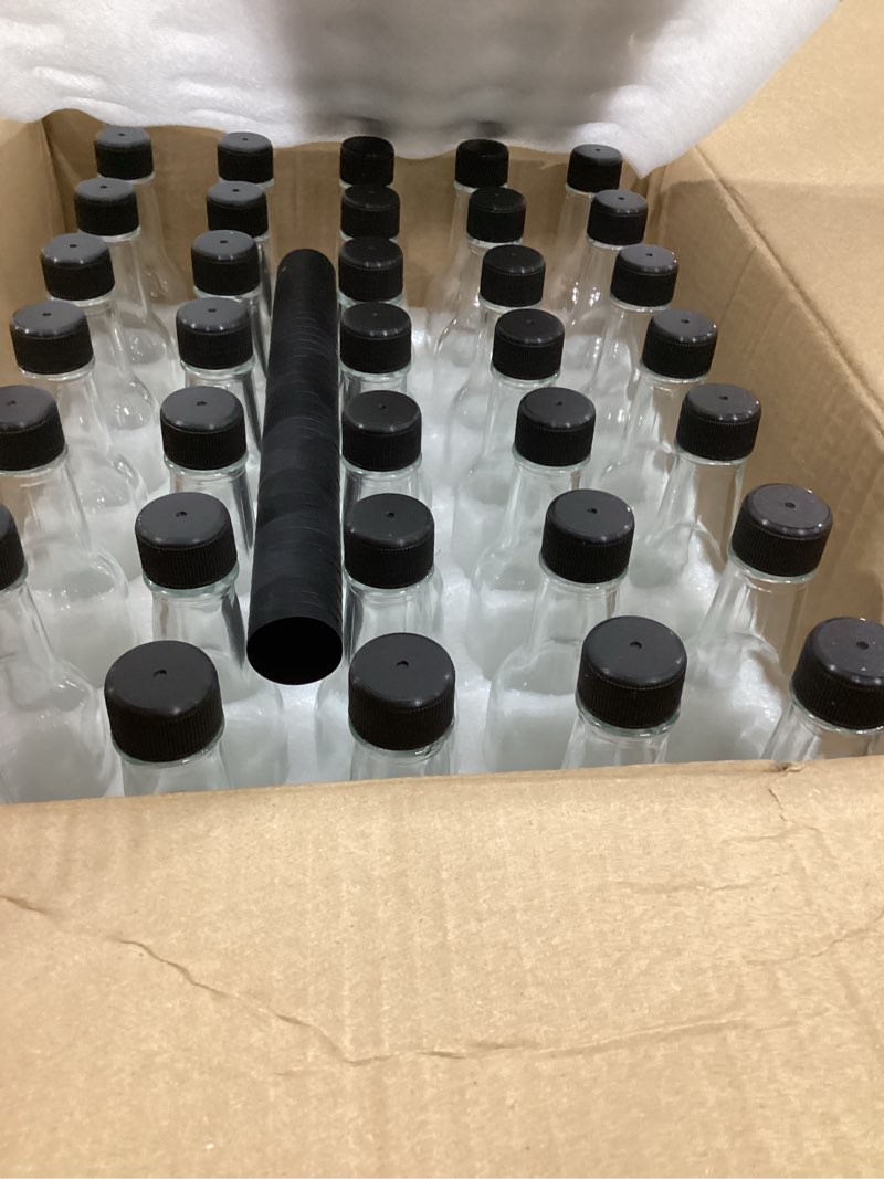 Condition photo showing Good Condition for Cedilis 35 Pack Glass Woozy Bottles, 5oz Clear Hot Sauce Bottles, Small Empty Liquor Wine Bottle with Shrink Capsule, Black Screw Caps, Dripper Insert, Labels and Funnels