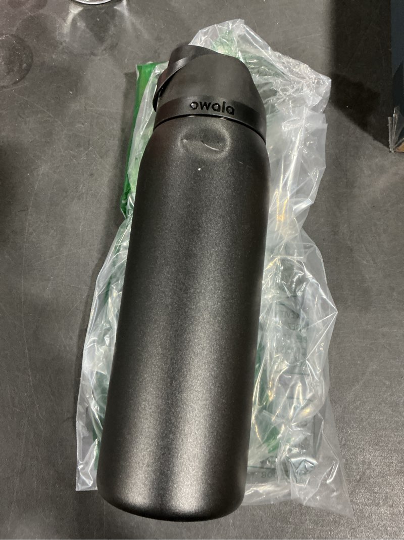 Condition photo showing As Is for Owala FreeSip Insulated Stainless Steel Water Bottle with Straw, BPA-Free Sports Water Bottle, Great for Travel, 40 Oz, Very, Very Dark Very, Very Dark 40 Ounces