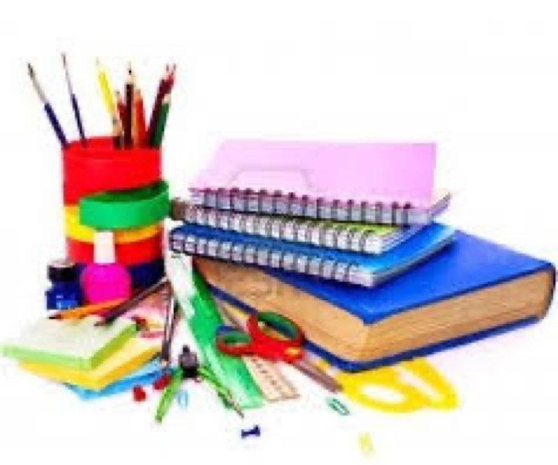 mixture of office and school supplies paper pencils notebooks 