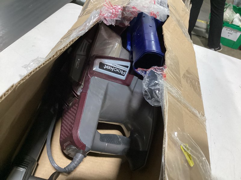 Condition photo showing As Is for Shark HV322 Rocket Pet Plus Corded Stick Vacuum with LED Headlights, XL Dust Cup, Lightweight, Perfect for Pet Hair Pickup, Converts to a Hand Vacuum, with (2) Pet Attachments, Bordeaux/Silver Rocket Deluxe w/ headlights