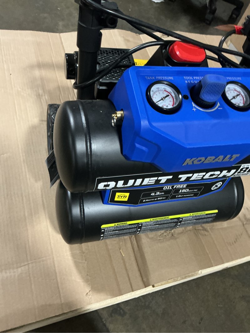 Condition photo showing As Is for kobalt quiet tech 4.3-gallon portable electric 150 psi twin stack air compressor