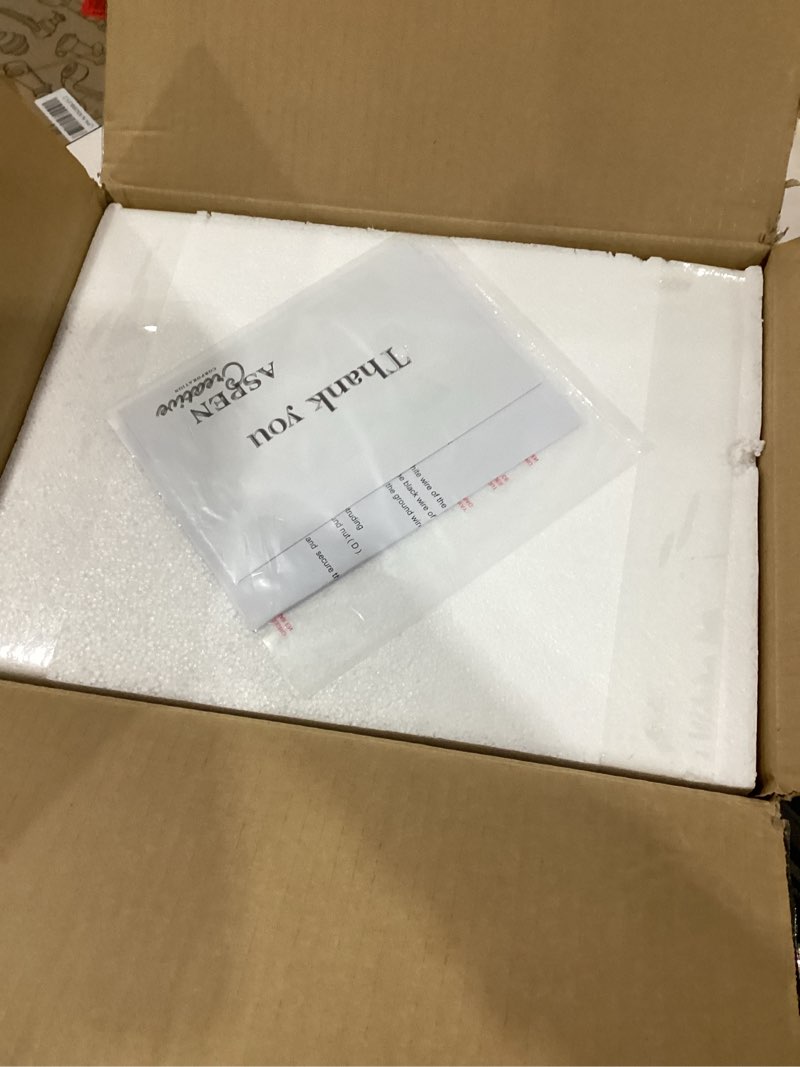 Condition photo showing New/Like New for Aspen Creative 62736-22-2, Two-Light Metal Bathroom Vanity Wall Light Fixture, 14" Wide, Transitional Design in Antique Brass with Clear Barrel Glass Shade 2 Light - 14" Width Antique Brass