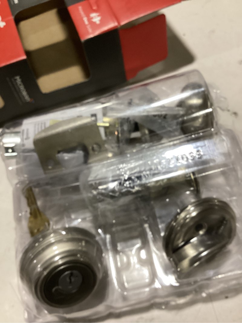 Condition photo showing As Is for juno satin nickel exterior entry door knob and single cylinder deadbolt combo pack featuring smartkey security