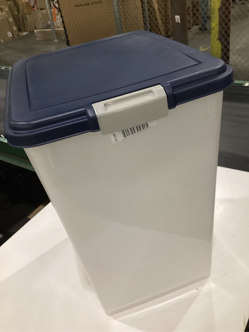 Condition photo showing item condition for amazon basics pet food storage container, similar to stock photos, no wheels, navy blue