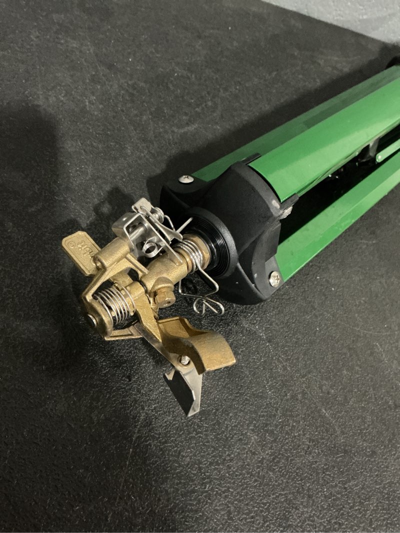 Condition photo showing As Is for green impulse tripod lawn sprinkler