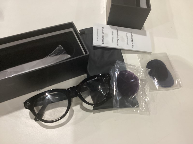Condition photo showing Good Condition for USED AI Smart Glasses with Camera, 2K Camera Glasses,12MP Video Recording Glasses, Real Time Translation, AI Voice Assistant,Sunglasses with 3 Pack Lenses - Photochromic Lenses,Purple and Blue Lenses Camera+Photochromic lenses Classic