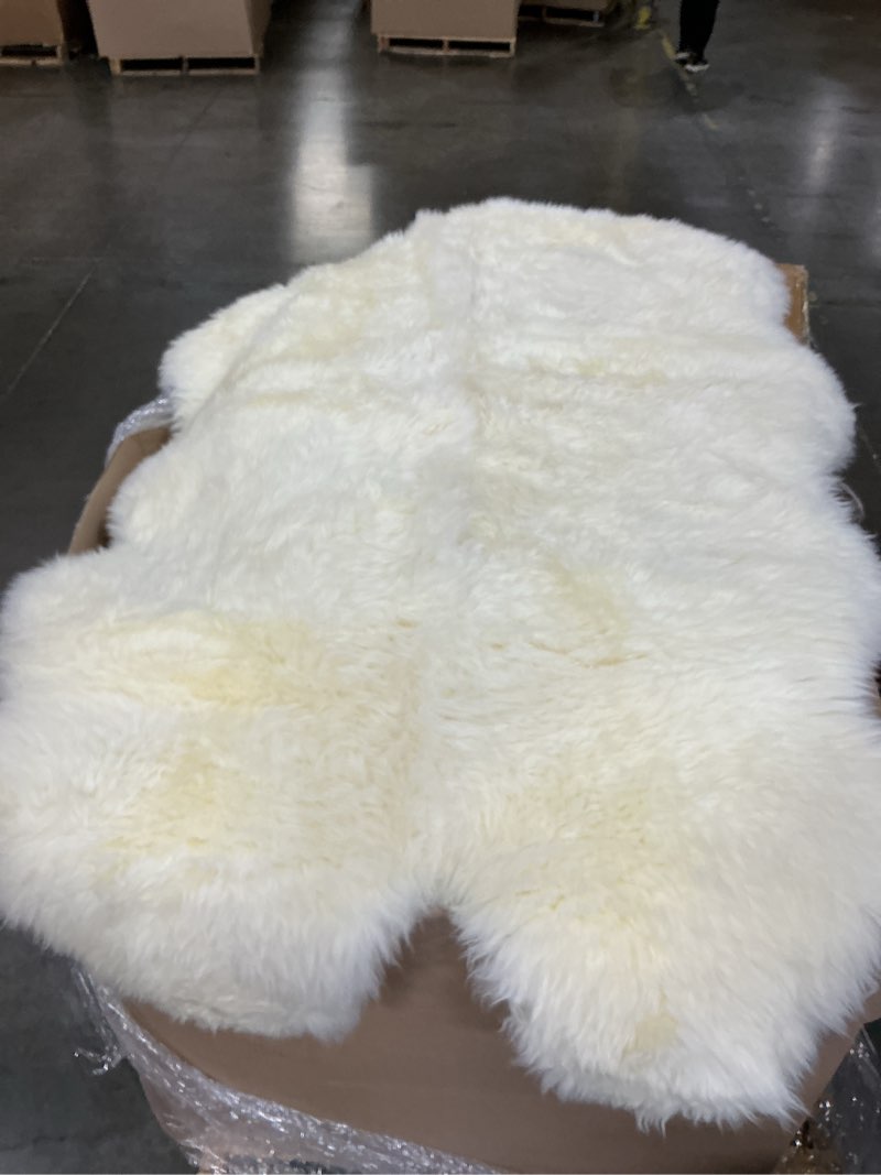 Condition photo showing Good Condition for faux fur white animal skin rug (similar to stock photo)