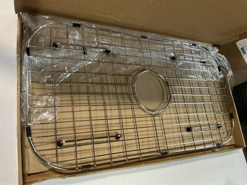 Condition photo showing Good Condition for sink protector grid 26-1/16" x 14-1/16", centered drain with corner radius 3-1/2", 304 stainless steel material (centered drain) for single bowl kitchen sink 26-1/16" x 14-1/16" centered drain