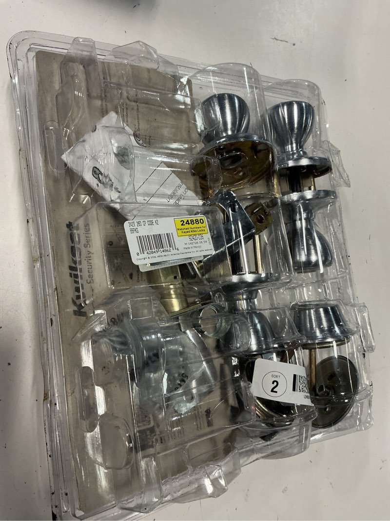Condition photo showing As Is for tylo satin chrome exterior entry door knob and single cylinder deadbolt project pack
