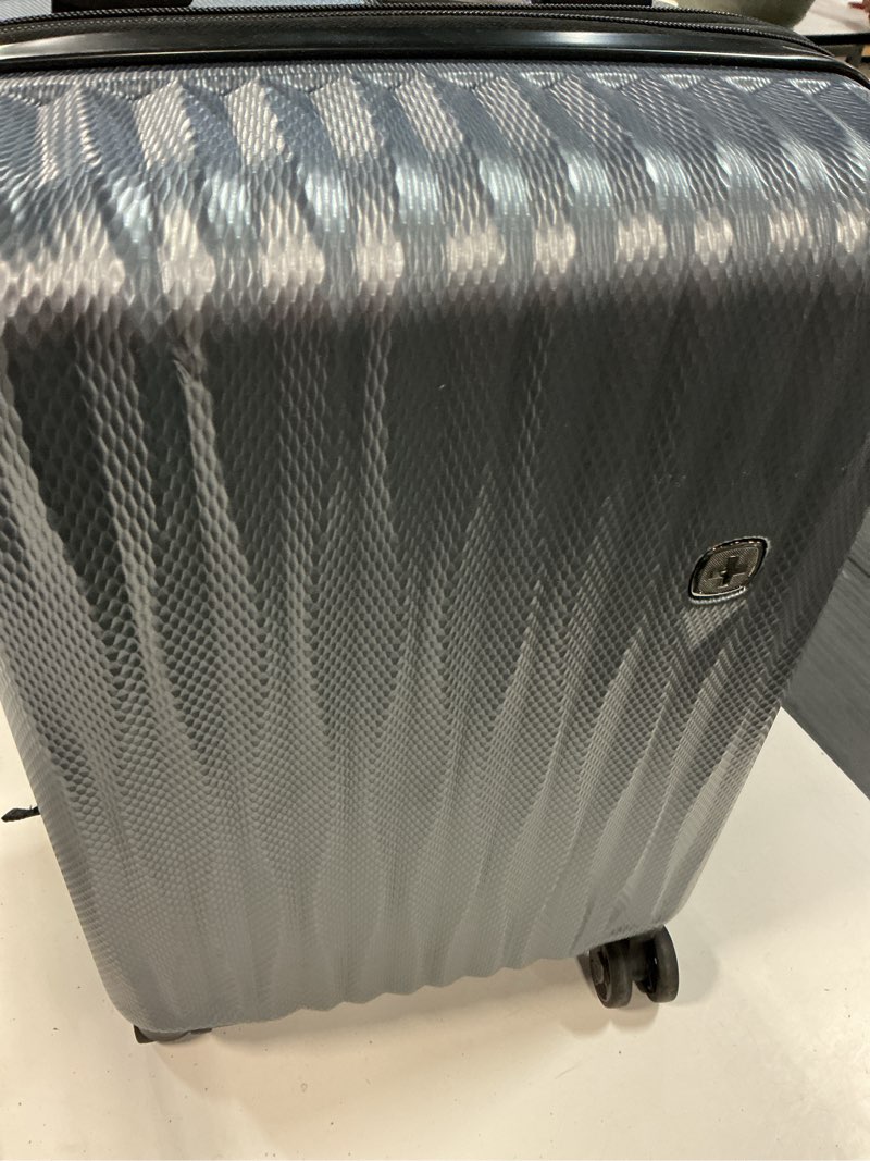 Condition photo showing As Is for swissgear energie hardside carry on spinner suitcase - iron gray