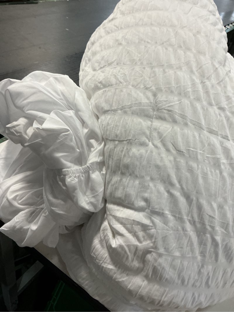 Condition photo showing As Is for CozyLux Queen Comforter Set White Seersucker 7 Pieces Bed in a Bag Queen Comforter Set with Sheets, Luxury Soft Bedding Set with Down Alternative Comforter, Sheets, Pillowcases & Shams for All Seasons White Queen