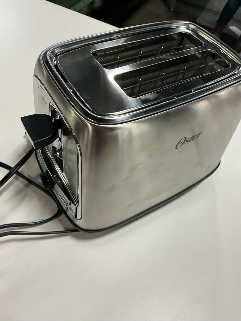 Condition photo showing As Is for Oster 2-Slice Toaster with Advanced Toast Technology, Bagel Toaster for All Bread Types, Stainless Steel 2-Slice Toaster Stainless Steel