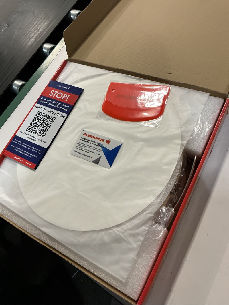 Condition photo showing New/Like New for KitchenStar 14-inch Pizza Stone for Oven and BBQ Grill with Handles, Round, 5/8" Thick - Natural Cordierite, 1800 °F Resistant, Baking Stone Set with Stainless Steel Rack & Plastic Scraper Tool 14 inch