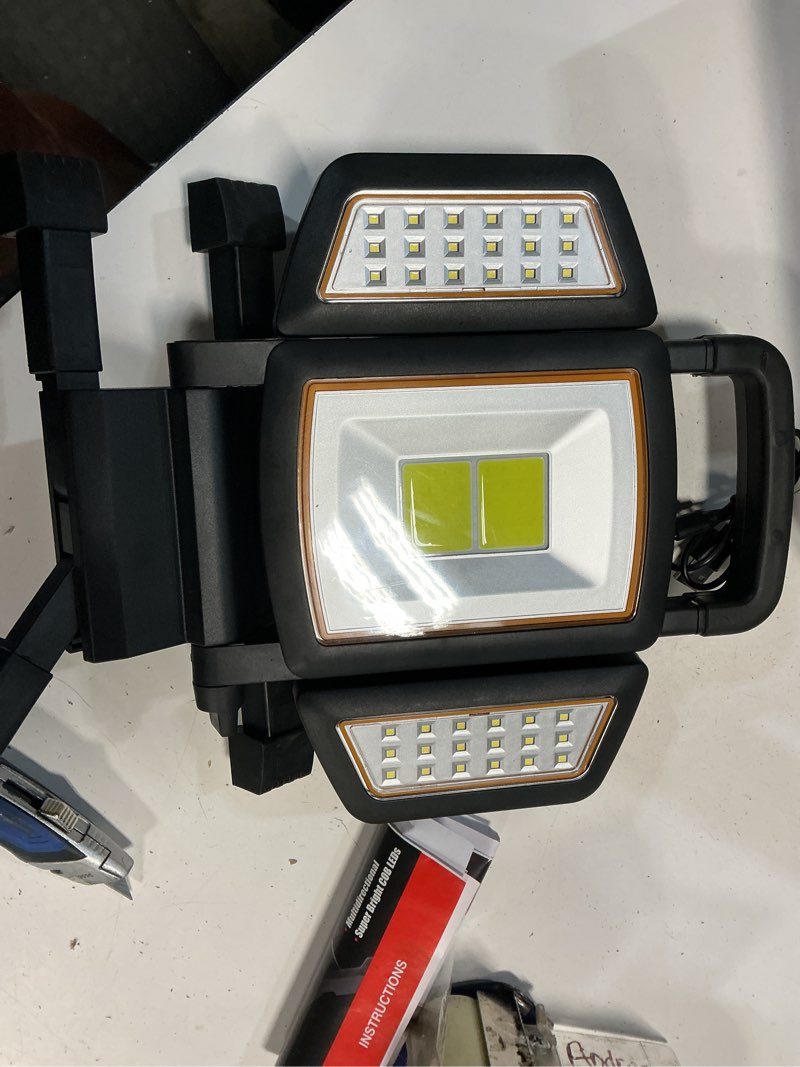 Condition photo showing As Is for bell + howell 1-ft 1500 lumens black led task garage shop light