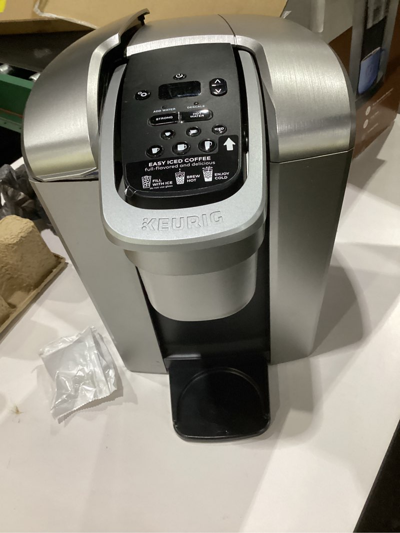 Condition photo showing As Is for keurig k-elite single serve k-cup pod coffee maker, with strength and temperature control, iced coffee capability, 8 to 12oz brew size, programmable, brushed silver, not tested