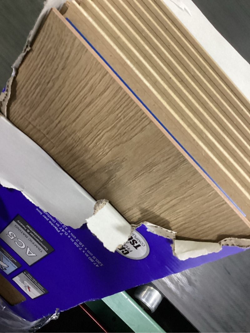 Condition photo showing New/Like New for select surfaces victoria spilldefense laminate flooring, 17.49 sq. ft. per box