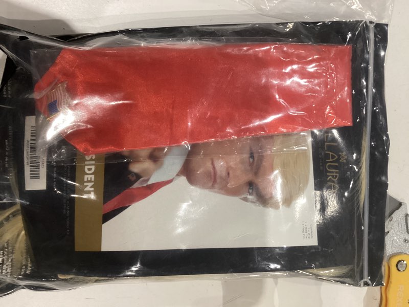 Condition photo showing Good Condition for ALLAURA 3pc Donald Costume Kit – Blonde Wig, Red Tie, Flag Pin – Compatible with Pres Donald Wig Halloween Costume for Adults, Couples, Cosplay, Political Events, Parody Outfits, Toupee Wig Look Donald Wig + Accessories