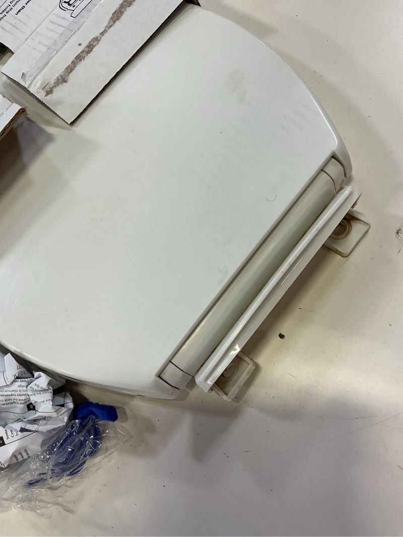 Condition photo showing As Is for kohler 20110-0 brevia, slow close toilet seat, elongated toilet seat, grip-tight bumpers quick-attach hardware, white white elongated quiet-close