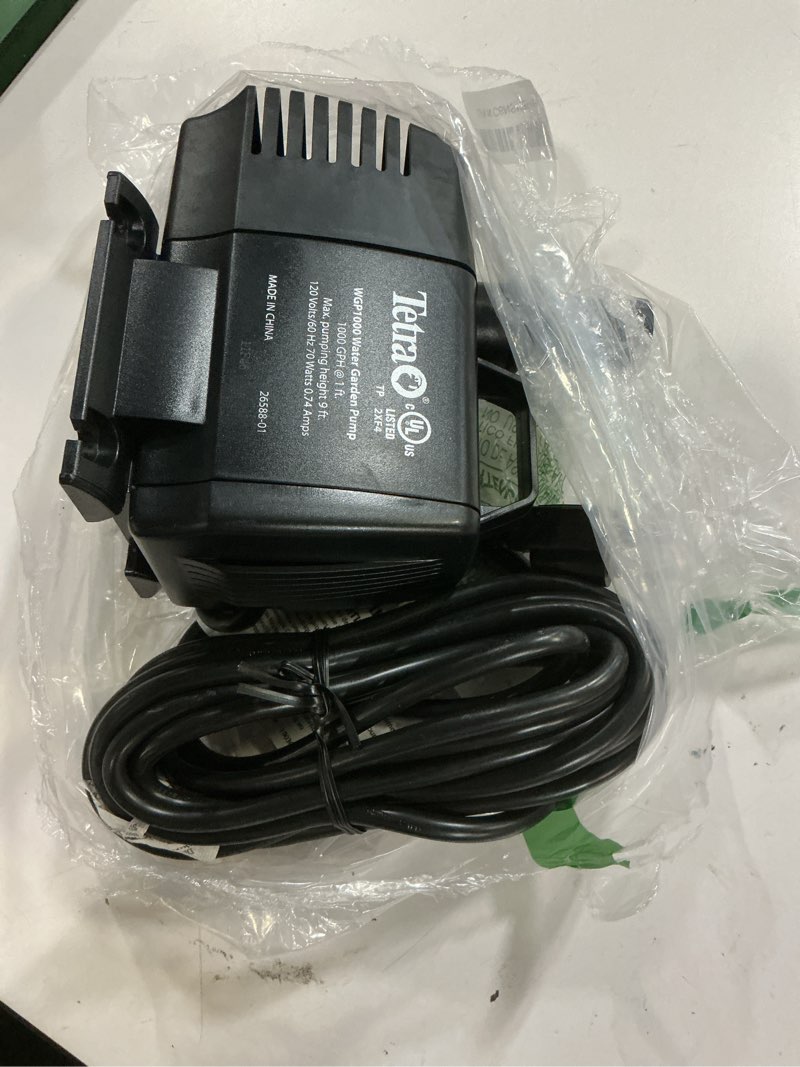 Condition photo showing As Is for tetrapond water garden pump, powers waterfalls/filters/fountain heads 500 to 1000 gallons