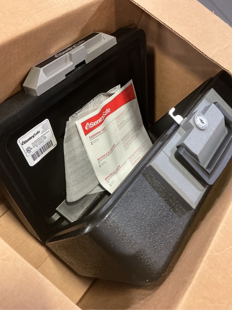 Condition photo showing Good Condition for sentrysafe fireproof safe box with key lock, chest safe with carrying handle to secure money, jewelry, documents, 0.25 cubic feet, 6.3 x 15.3 x 12.1 inches, 1160 fire resistant box 0.25 cu. ft.