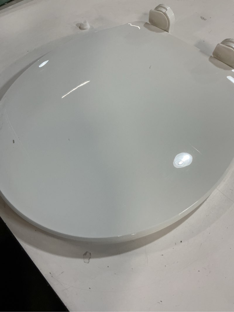 Condition photo showing As Is for Clorox Round Beveled Plastic Toilet Seat with Easy-Off Hinges – Wiggle-Free Design Round Plastic