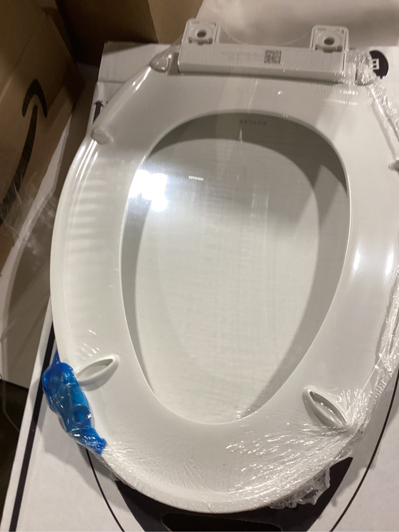 Condition photo showing New/Like New for kohler 20110-0 brevia, slow close toilet seat, elongated toilet seat, grip-tight bumpers quick-attach hardware, white white elongated quiet-close