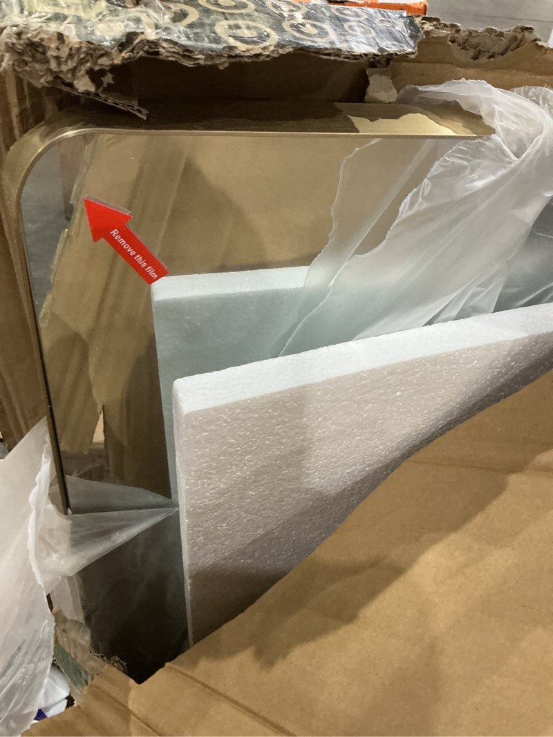 Condition photo showing New/Like New for gold bathroom mirror, 60x36 inch brushed gold metal frame mirror for wall, rounded rectangle bathroom vanity mirror, tempered glass, anti-rust, horizontal/vertical gold 60"l x 36"w