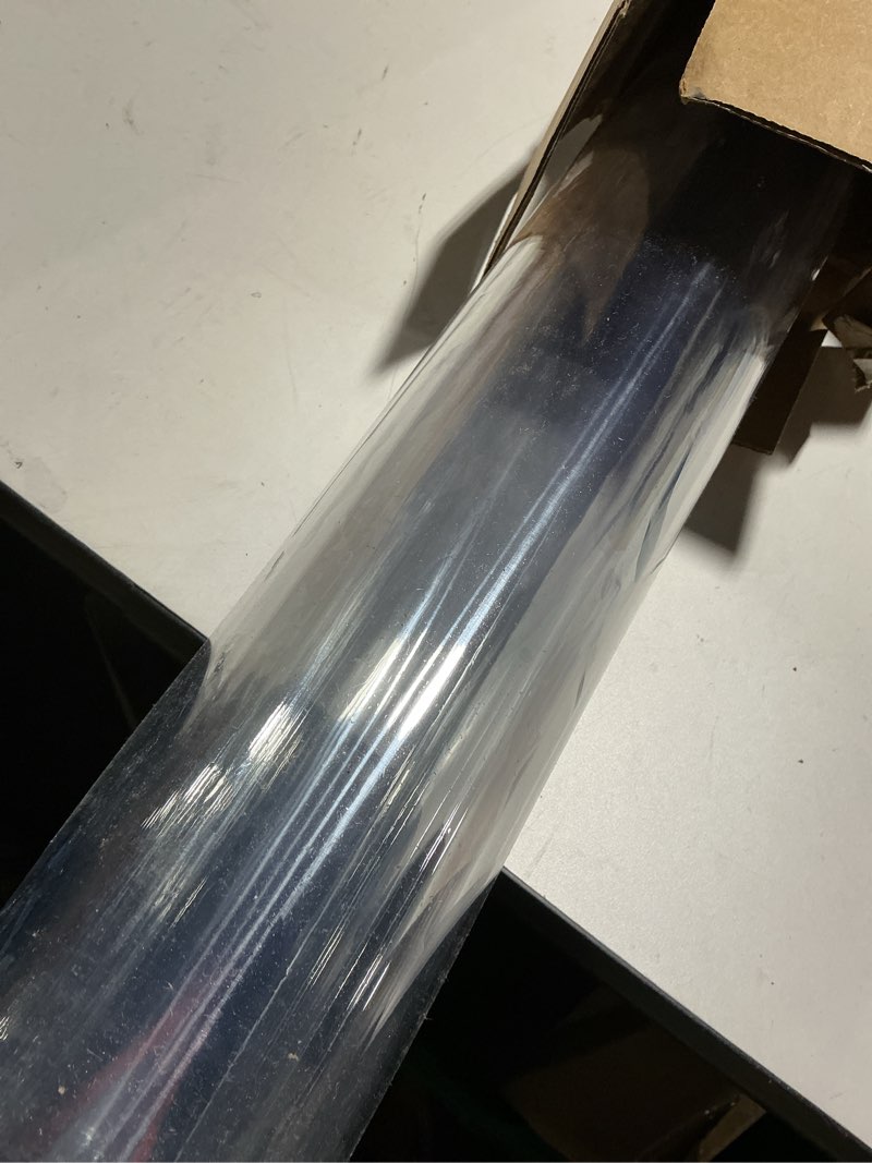 Condition photo showing As Is for Warmstar Clear Table Protector 2mm Thick, 42x75Inch Clear Table Cover Protector, Plastic Table Cover, Clear Desk Mat Desk Pad, Desk Protector Mat for Coffee Table, Writing Desk, Dining Room 42" x 75"