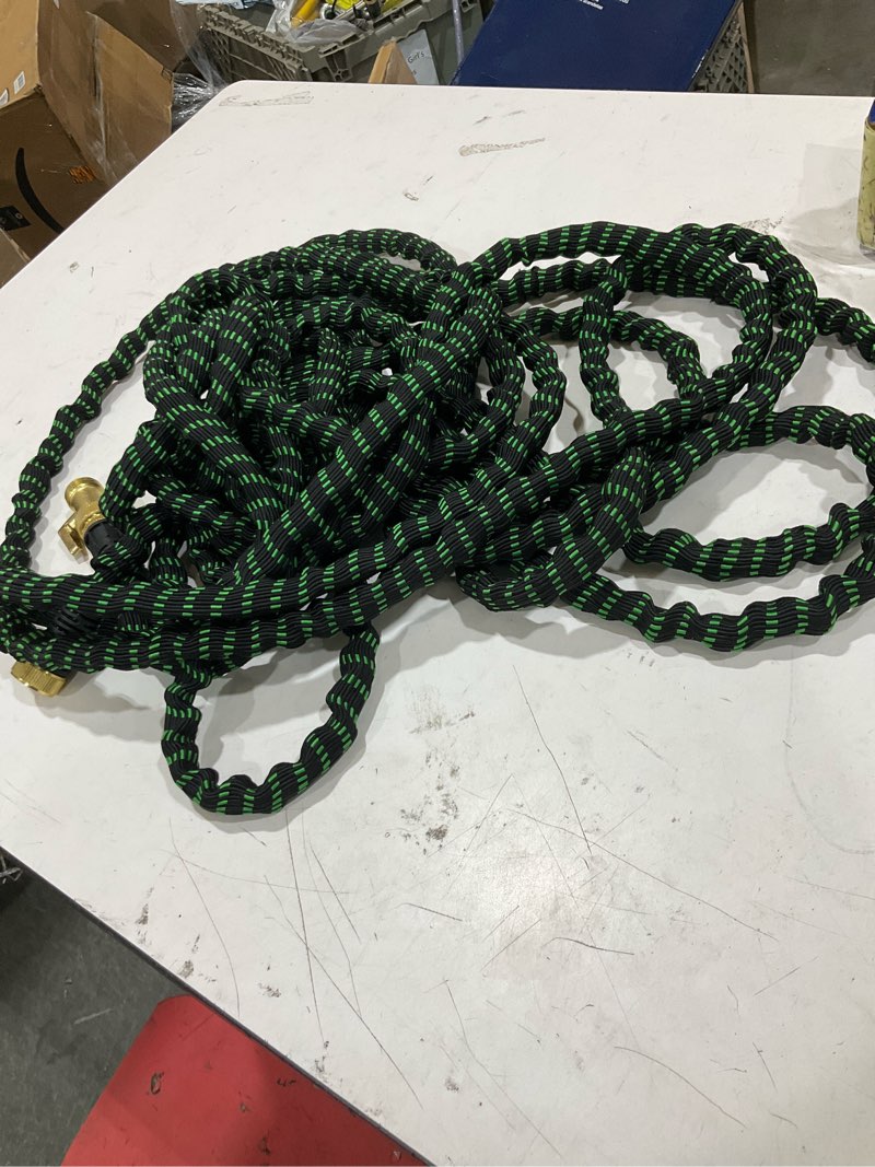 Condition photo showing As Is for flex-able hose xtreme 1-in x kink free woven green hose