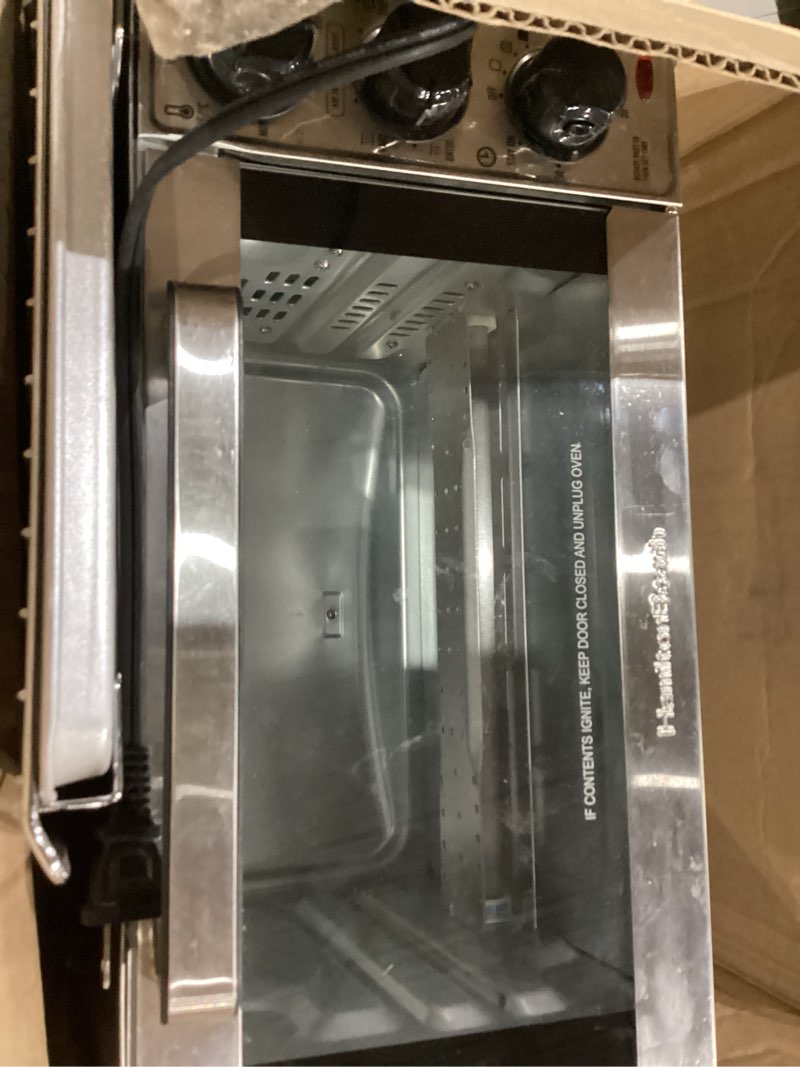 Condition photo showing Good Condition for hamilton beach 4-slice toaster oven with 5 cooking modes (bake, broil, keep warm toast & bagel) with stay on & auto shutoff, 2 rack positions, 1100 watts and 3 accessories, stainless steel (31143)