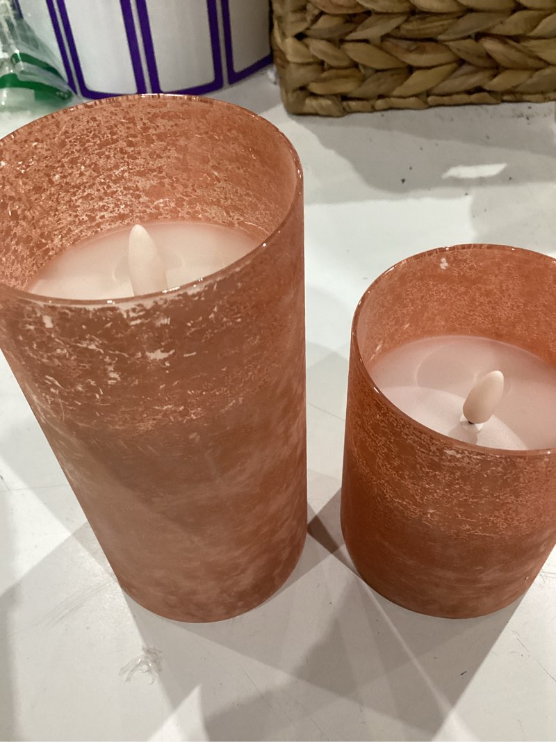 Condition photo showing As Is for orange flameless candles, sandblast glass battery operated candles with 10-key remote and timer,set of 2 realistic wax candles