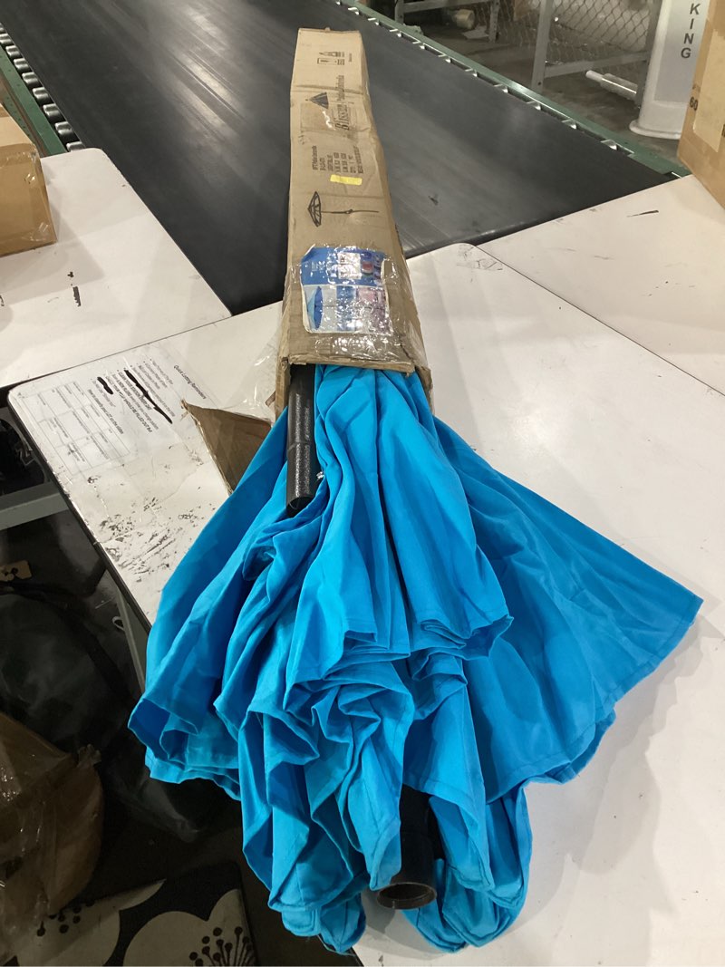 Condition photo showing Good Condition for 9' outdoor patio umbrella, outdoor table umbrella, yard umbrella, market umbrella with 8 sturdy ribs, push button tilt and crank light blue