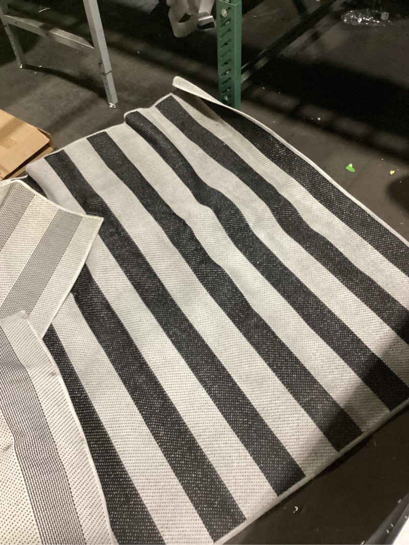 Condition photo showing Good Condition for mainstays black and white striped cabana woven outdoor rug, 5'x7'