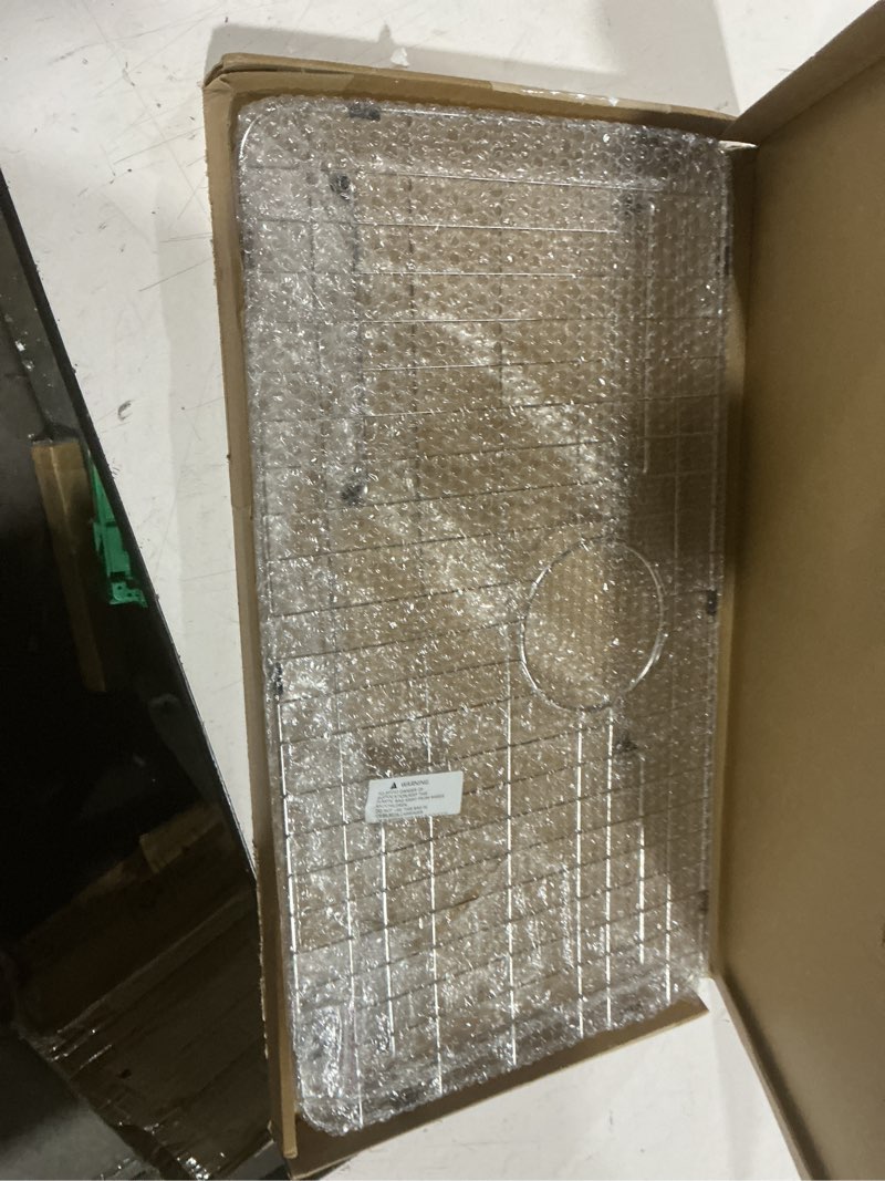 Condition photo showing Good Condition for stainless steel sink grid and protectors for bottom of kitchen sink, 26" x 14" with rear drain for single sink bowl (26" x 14 1/16") 26" x 14 1/16" with rear drain