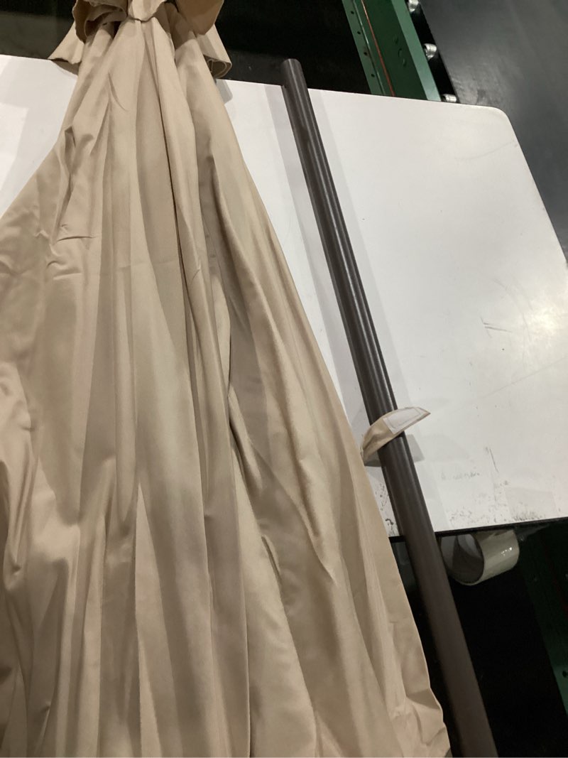 Condition photo showing Good Condition for jearey 6.5x10 ft rectangular patio umbrellas rectangle outdoor umbrella with push button tilt and crank, market table umbrella 6 sturdy ribs uv protection for poolside garden backyard deck, beige 6.5x10ft beige