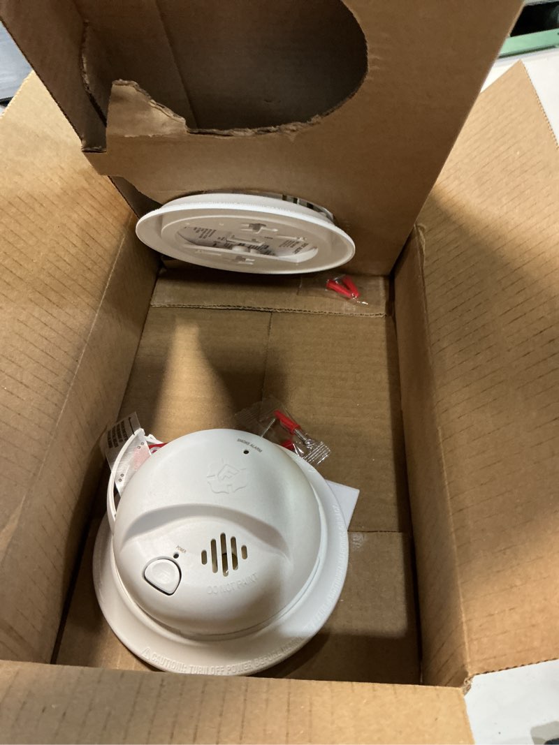 Condition photo showing As Is for first alert smi100, battery-operated smoke alarm, 2-pack 2-pack precision detection smi100