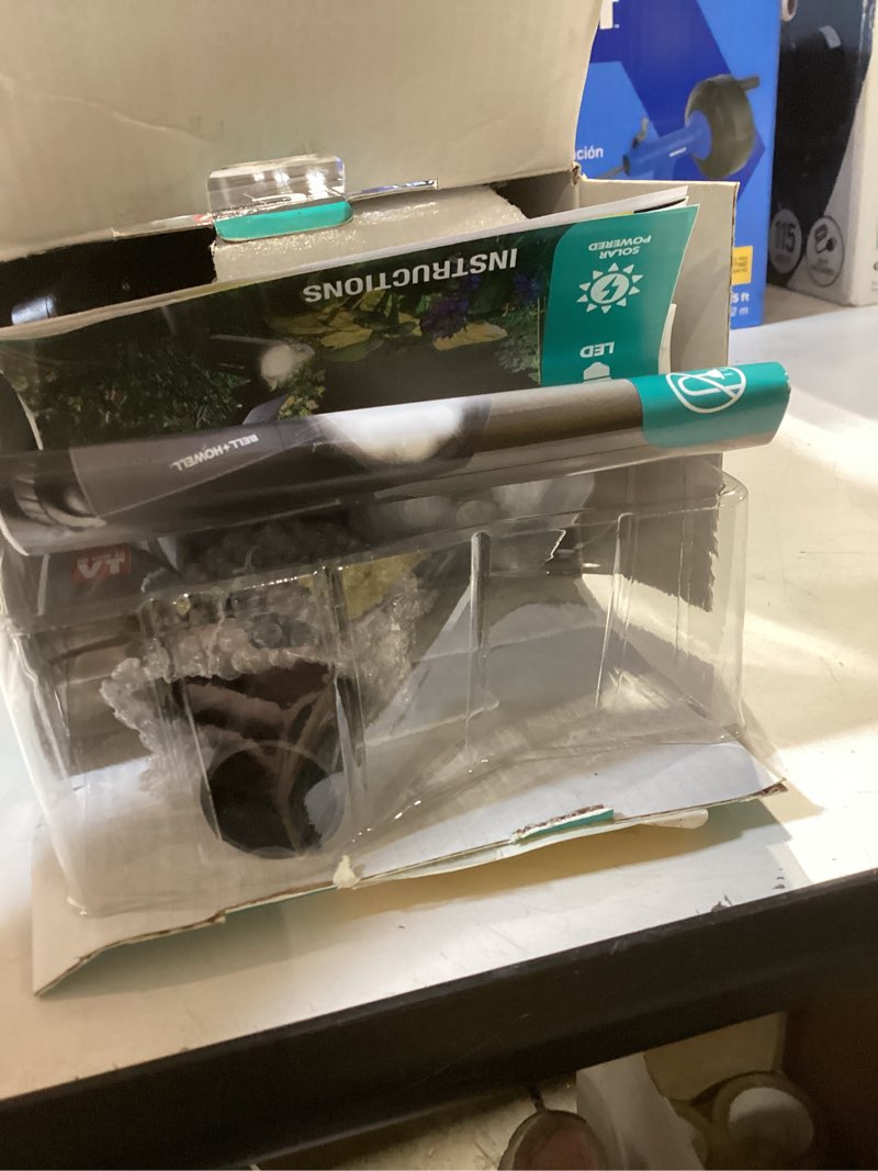 Condition photo showing As Is for bell + howell bionic spotlight solar powered motion activated outdoor spotlight night light