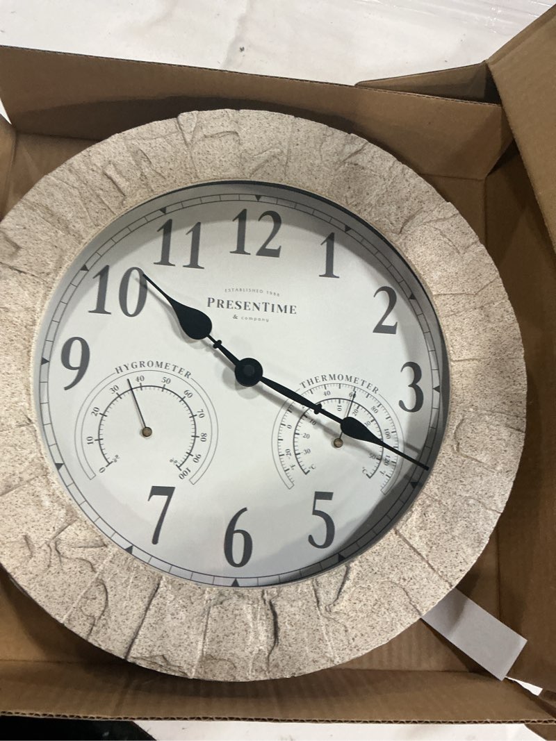 Condition photo showing New/Like New for Presentime & Co Sandstone Outdoor Clock with Thermometer & Hygrometer as All in one Weather Station, 14", Gray Sandstone Finish. Weather Thermometer, Outdoor Décor, Wall Décor.
