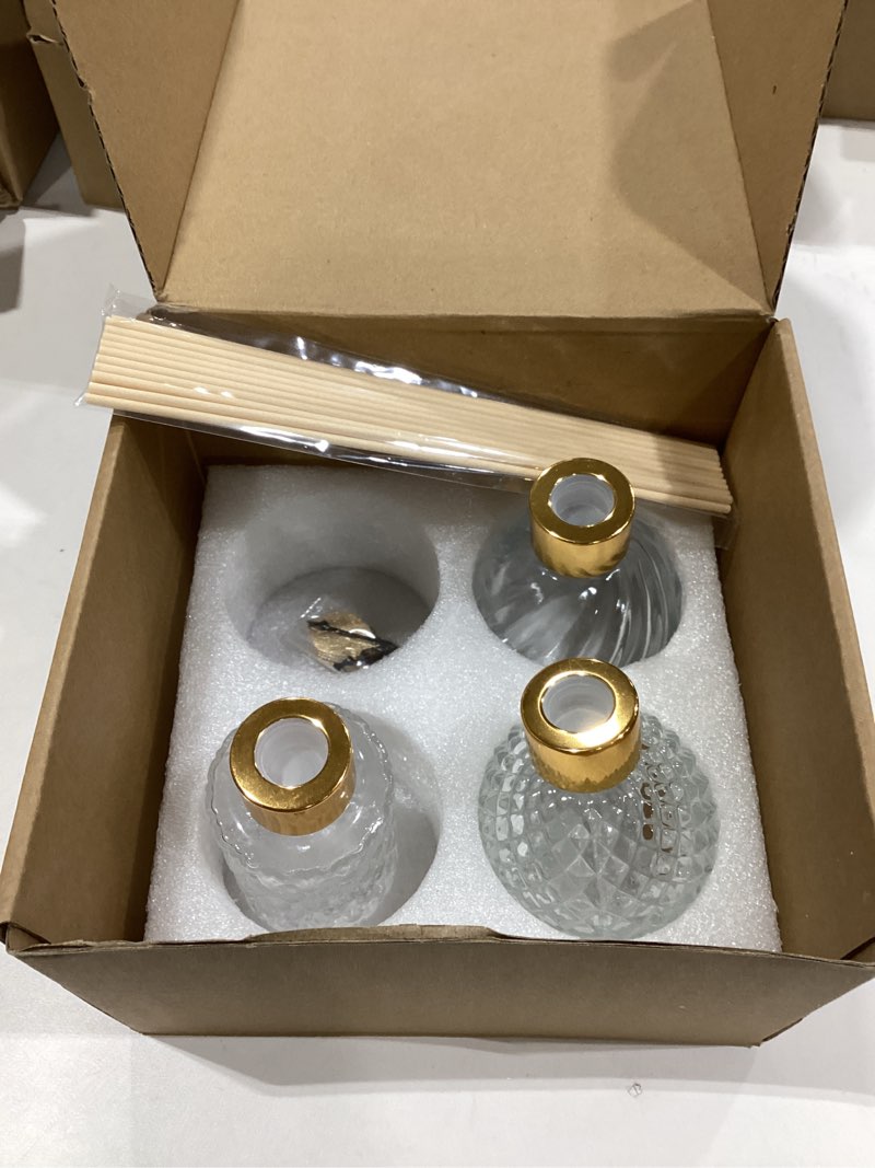 Condition photo showing Good Condition for 3-Piece Reed Diffuser Set with Metal Golden Decoration, 3.5 -4.2oz Empty Bottles and 20 Reed Sticks, Unique Design for  Home and Office (4 Different Bottles) 4 Pcs Different Bottles  . Missing one