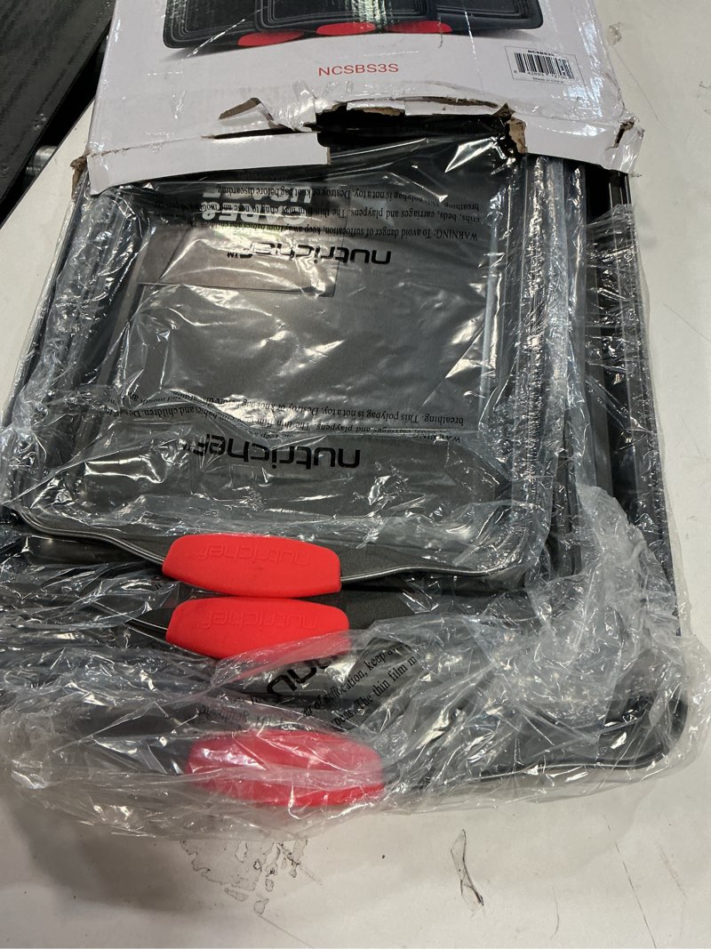 Condition photo showing Good Condition for NutriChef 3-Piece Nonstick Kitchen Oven Baking Pans - Premium & Stylish Non-Stick Steel, Commercial Grade Restaurant Quality Metal Bakeware with Red Silicone Handles - Easy to Clean, NCSBS3S 3-Piece Set