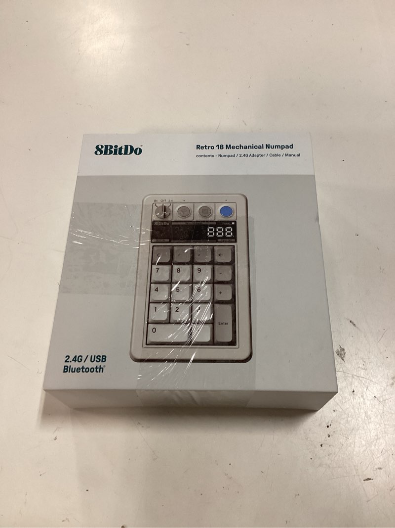 Condition photo showing New/Like New for 8bitdo 18 key retro mechanical numpad, supports pc & standard calculator mode, hot-swappable, pc calculator shortcut button, bluetooth/2.4g/wired for windows and android - m edition