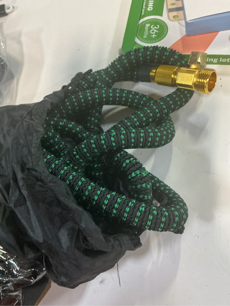 Condition photo showing As Is for 25 ft garden hose,2026 new improved lightweight all-weather water hoses, ultra durable and flexible garden hose with 10-function spray nozzle, leak-free connections garden hose for yard, lawn,outdoor blackgreen 25ft