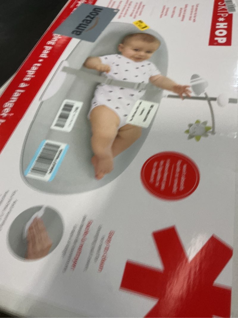 Condition photo showing New/Like New for Skip Hop Baby Changing Pad Nursery Style Wipe-Clean Contoured with Cushioned Foam, Non-Skid Base, Built-in Safety Belt & Tuck-Away Toy Bar, Grey 18" Grey