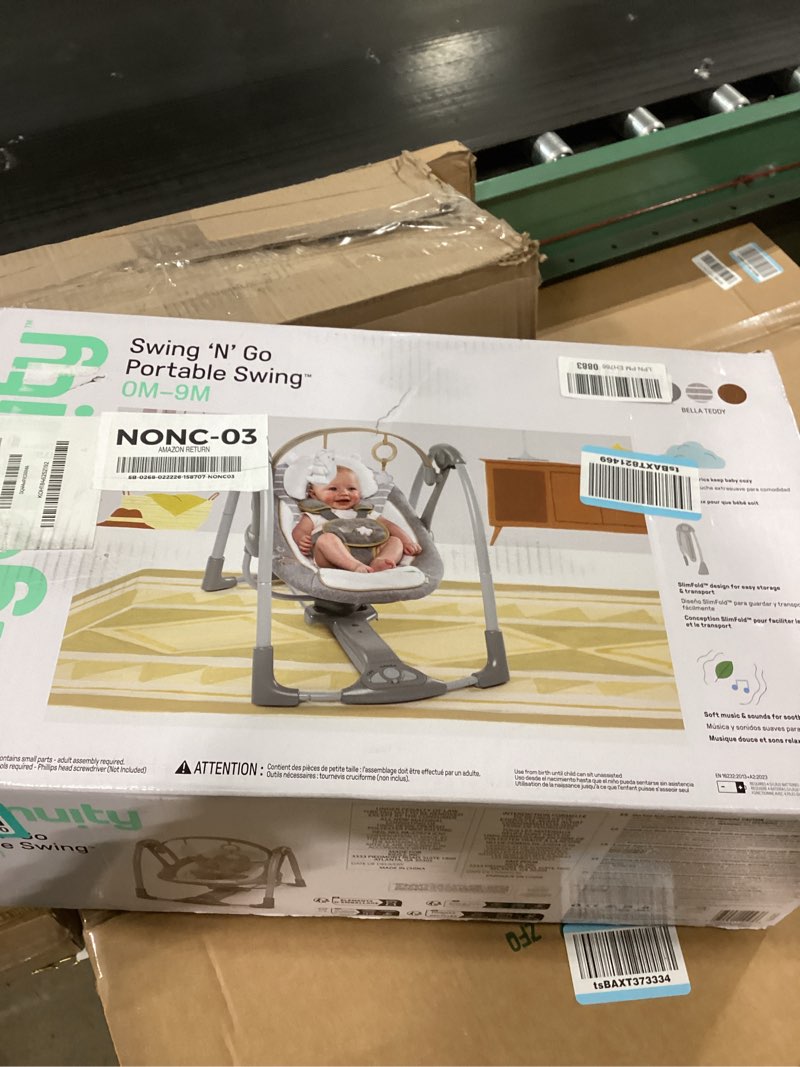 Condition photo showing item condition for Ingenuity Swing 'n Go Deluxe 5-Speed Baby Swing with Cushioned Harness - Foldable, Portable, 2 Plush Toys & Sounds, 0-9 Months 6-20 lbs (Bella Teddy)