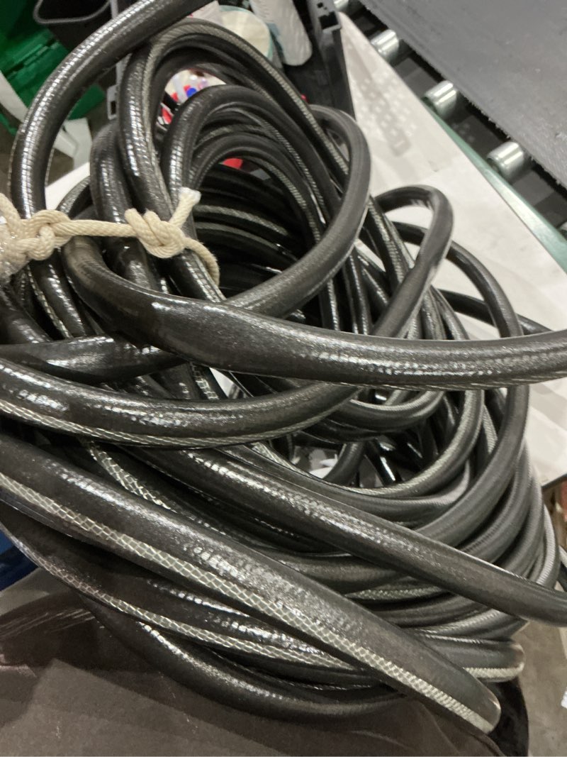 Condition photo showing As Is for neverkink teknor apex 5/8-in x 100-ft heavy-duty kink free vinyl gray coiled hose