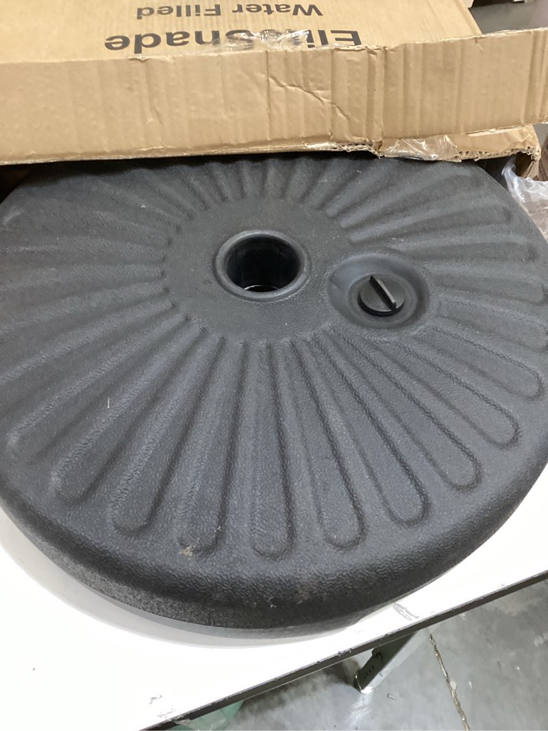 Condition photo showing As Is for eliteshade umbrella base water filled stand market patio outdoor heavy duty umbrella holder(black) black 50 lbs