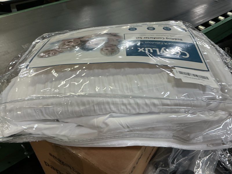 Condition photo showing As Is for CozyLux King Size Comforter Set White Seersucker 7 Pieces Bed in a Bag King Comforter Set with Sheets, Luxury Soft Bedding Set with Down Alternative Comforter, Sheets, Pillowcases & Shams All Seasons White King