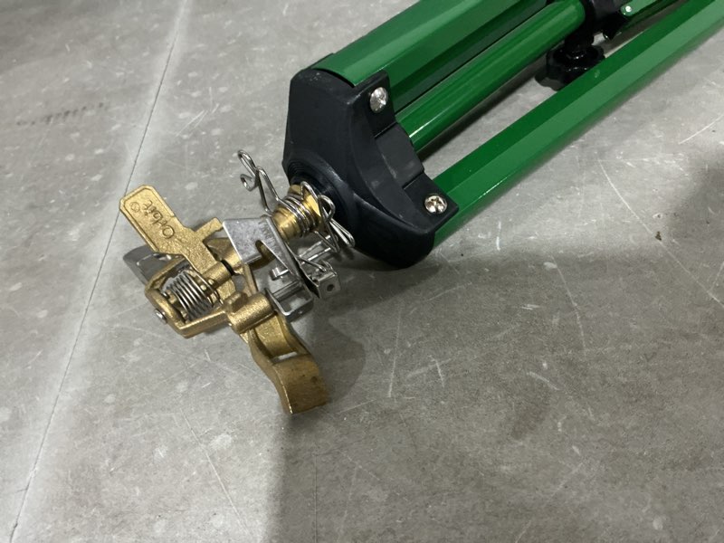 Condition photo showing As Is for green impulse tripod lawn sprinkler